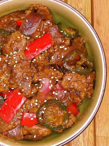 Tender marinated beef stir fry in a finger licking garlic-ginger sauce. This beef stir fry is one of the fastest and easiest recipes you'll make all year!