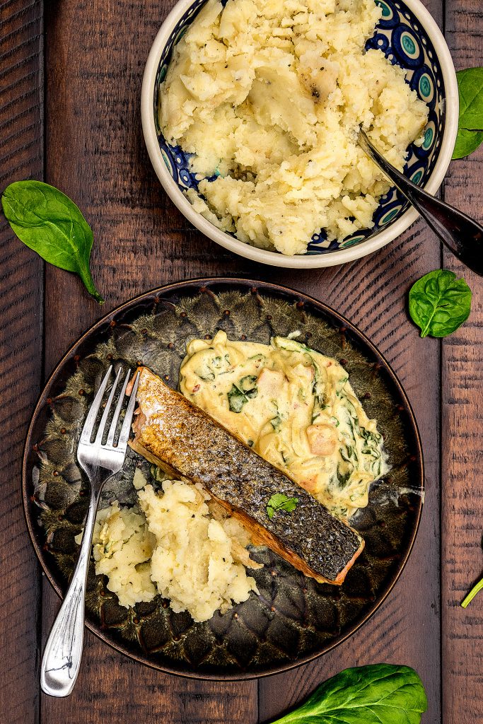 Crispy pan seared salmon in a creamy curried spinach sauce. Perfect for weeknights, this deliciously easy, restaurant style meal is ready in 30 minutes!