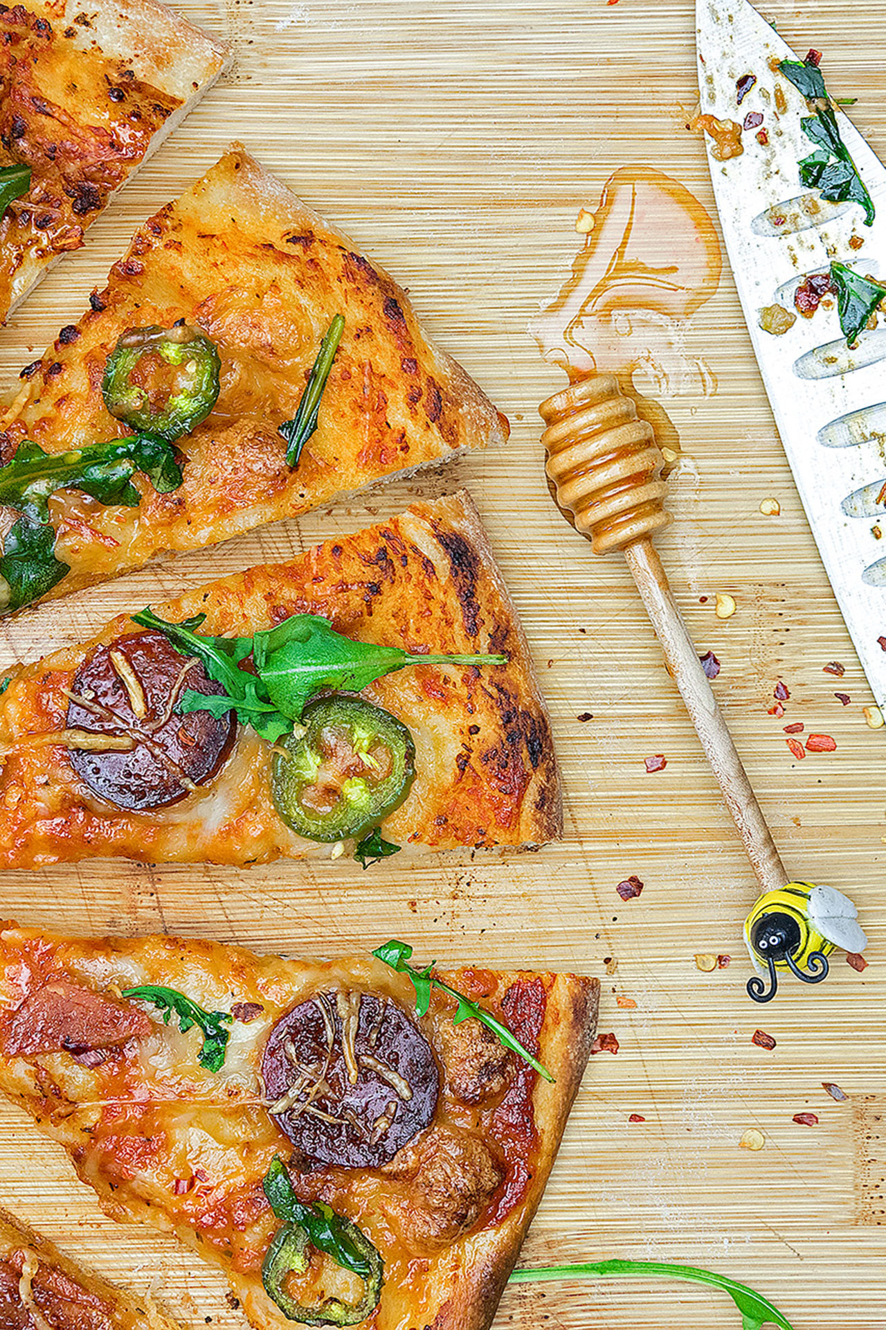 A simple, yet effortlessly stunning pepperoni pizza covered with handfuls of fresh arugula and drizzled with ribbons of chili-spiced hot honey.