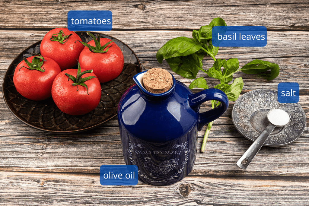 Ingredients for pizza sauce with fresh tomatoes - includes fresh, sun ripened tomatoes and salt.  Optional ingredients of fresh basil leaves and olive oil is also shown