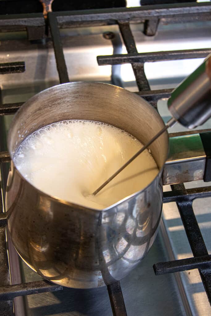 Steaming and foaming the Milk with a frothing wand
