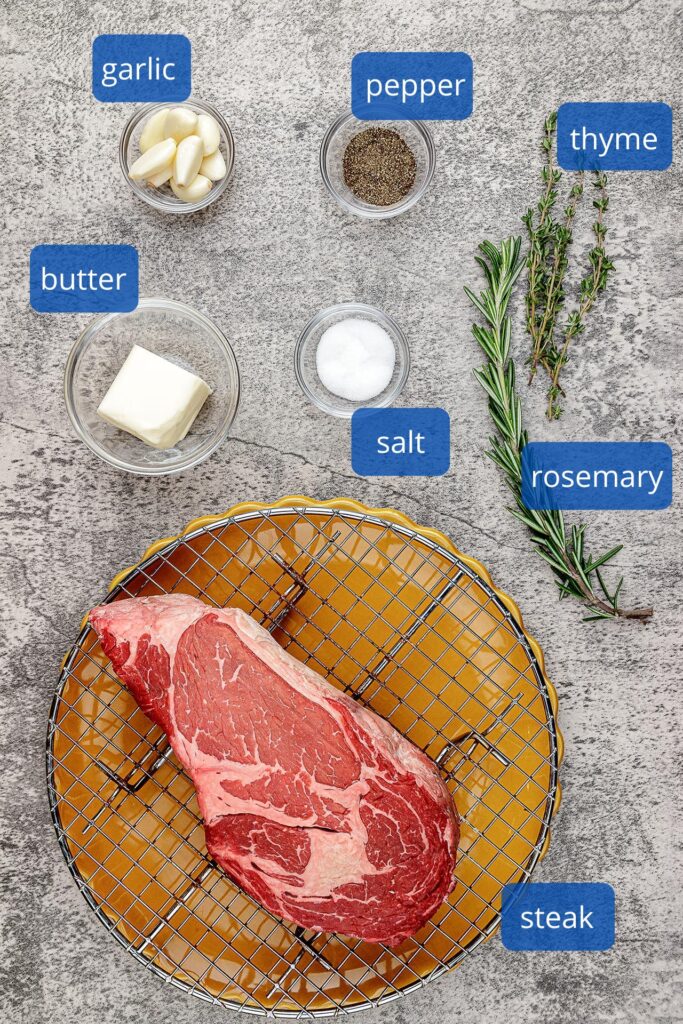 Steak Ingredients - ribeye steak, salt, pepper, butter, rosemary and thyme