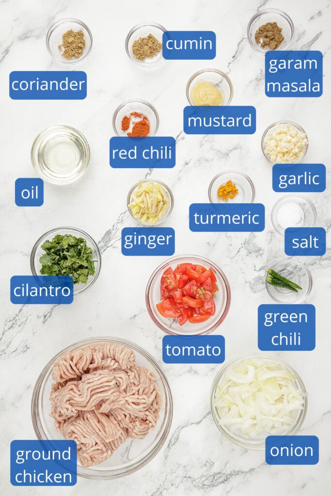 Chicken Keema Ingredients: coriander, cumin, garam masala, red chili, mustard, garlic, ginger, oil, turmeric, salt, cilantro, tomato, green chili, ground chicken and onion.